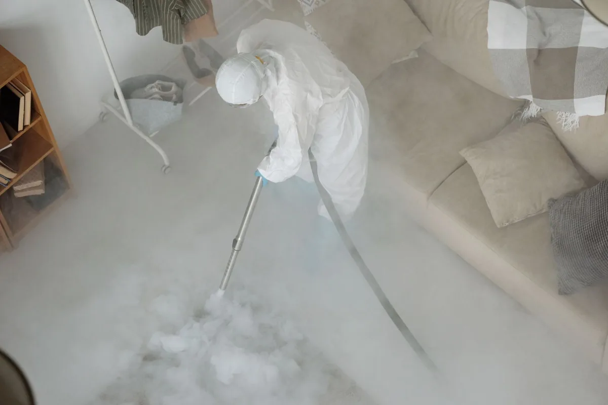 Biohazard cleanup technician in protective equipment, Andalusia, AL